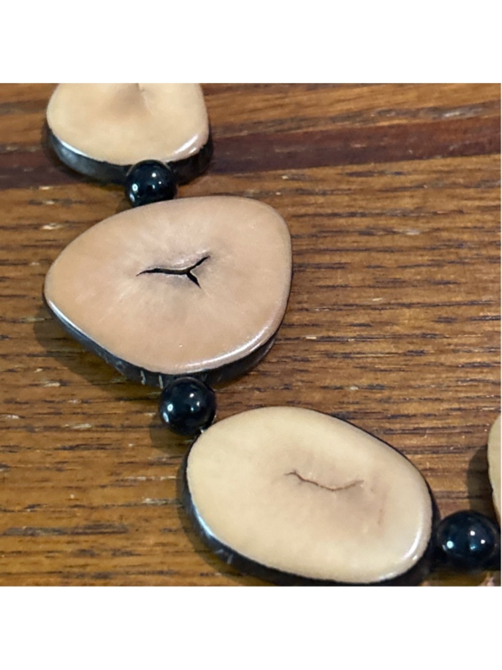 artisan necklace features smooth, tan tagua nut slices & dark beads 16” - Picture 2 of 2